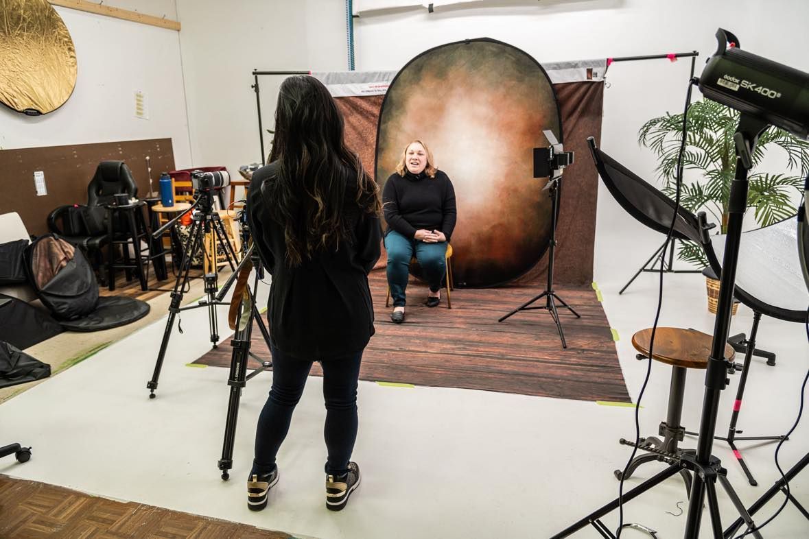 Owner of Beyond Words Jamie Perez interviews woman on camera in studio setting